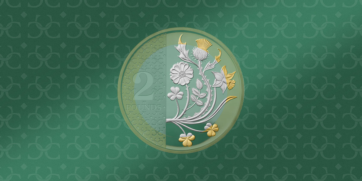 A 2023 flora and fauna two pound coin with a light green tint set against a green background
